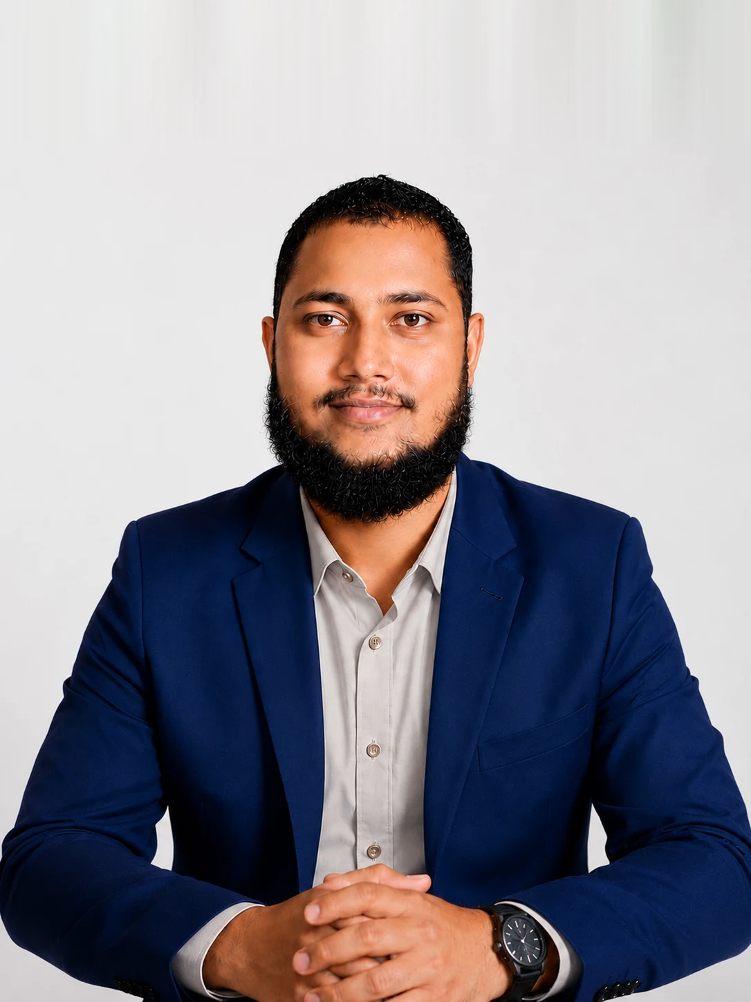 Ashikur Rahman, SEO and AI search specialist and founder of Proximity Ranker, at his desk in a navy blazer